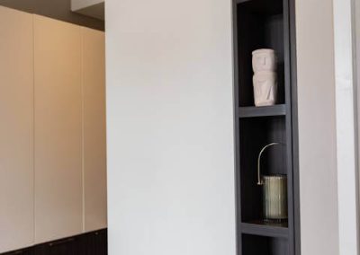 Stylish shelving unit with modern decor inside Menlyn Maine apartment